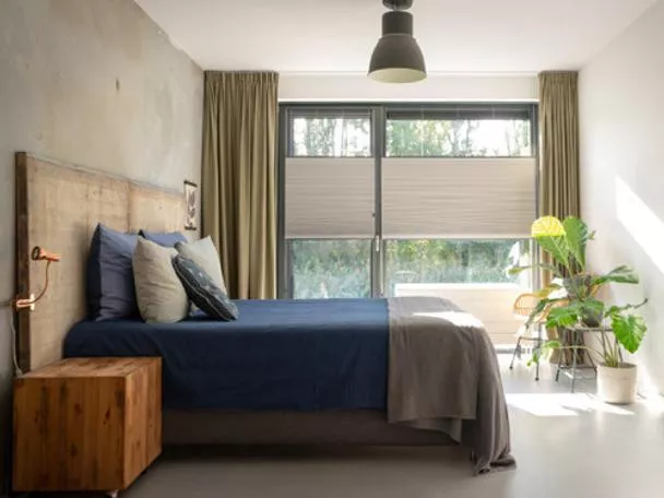 Pleated blinds on large windows in a bedroom in Sittard-Geleen, Limburg