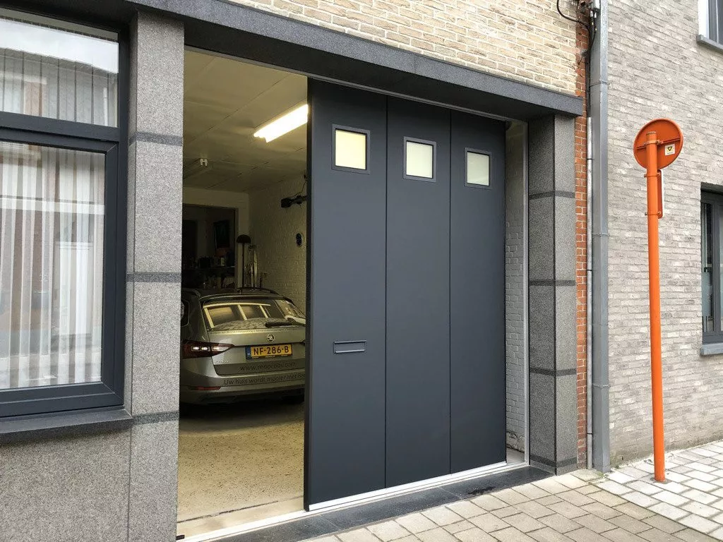 Modern grey side-sliding sectional door with three windows, ideal for garage security and looks.