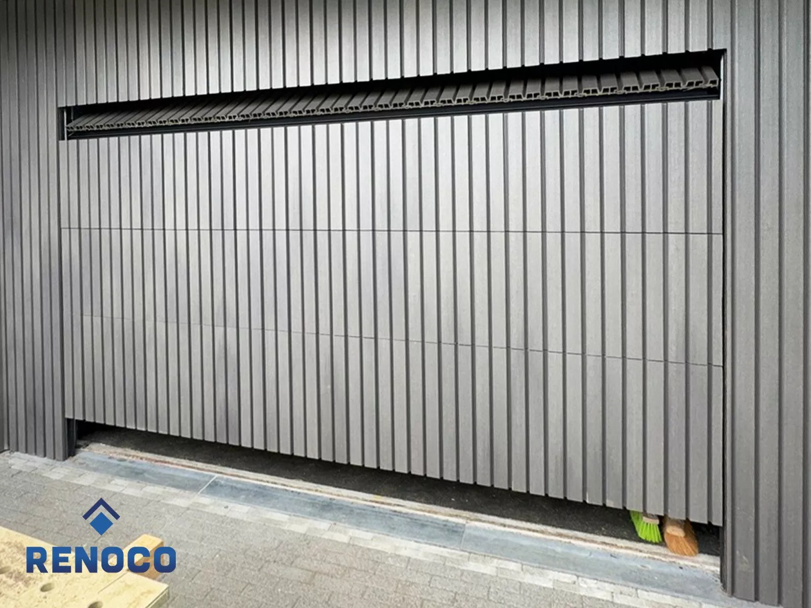 Composite cladding with a sectional garage door in Sittard-Geleen or elsewhere in Limburg.