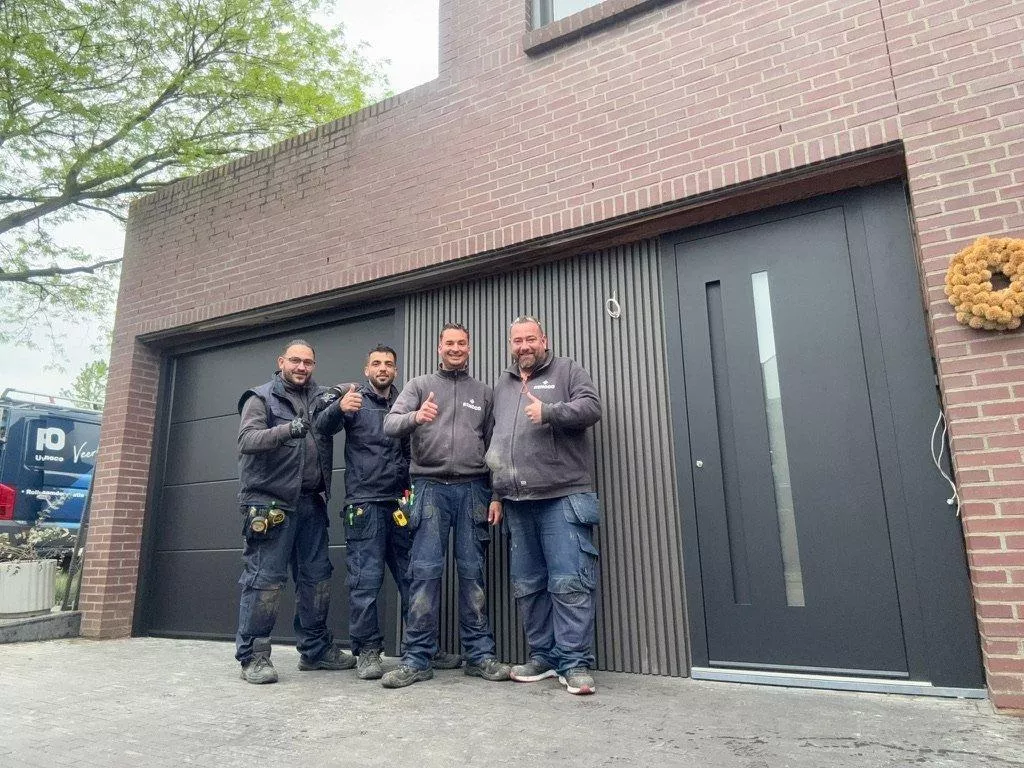 Renoco installers after fitting a modern made-to-measure garage door and front door