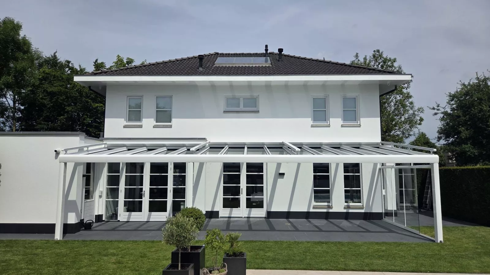 Modern patio cover attached to the house, with glass elements, in Sittard - Geleen, Limburg