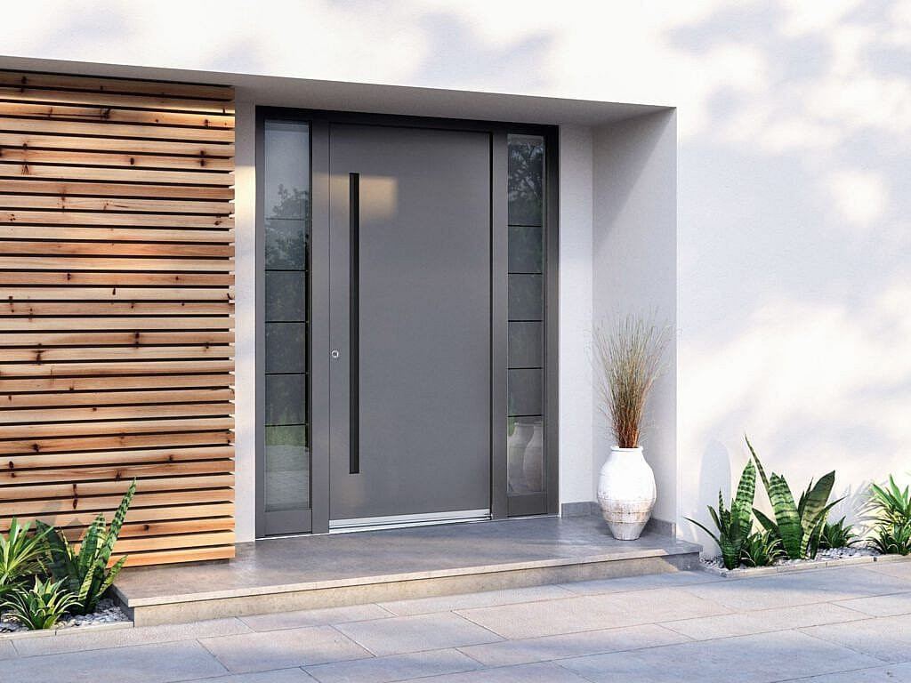 Grijze aluminium voordeur met glazen panelen en composiet gevelbekleding in Sittard - Geleen Limburg.