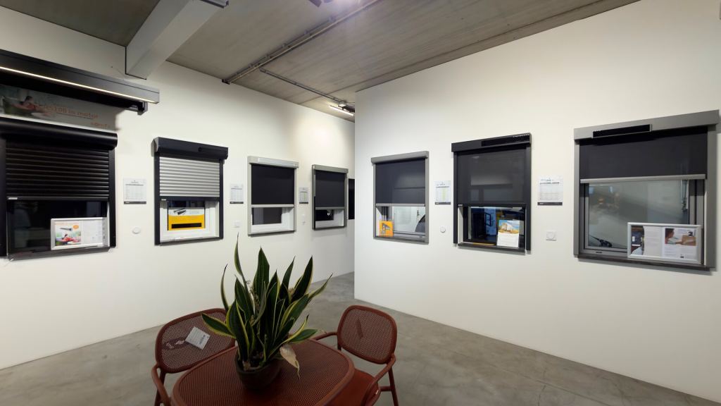 Working roller shutters and screens on display in the Renoco showroom.