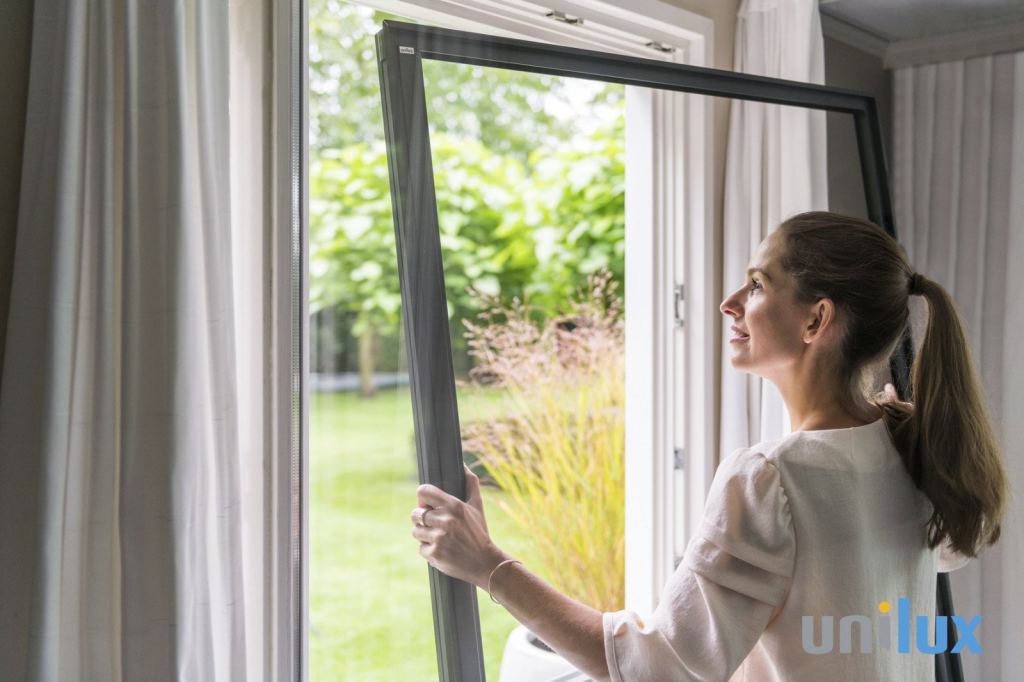 Unilux insect screen on a ground-floor window overlooking the garden in Sittard-Geleen, Limburg.