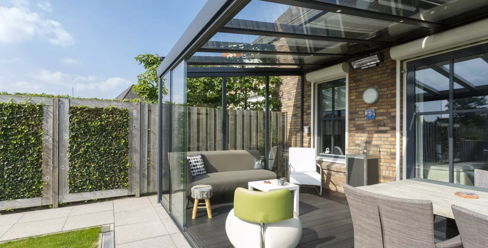 Veranda with sliding glass walls, cosily furnished, in Sittard-Geleen, Limburg