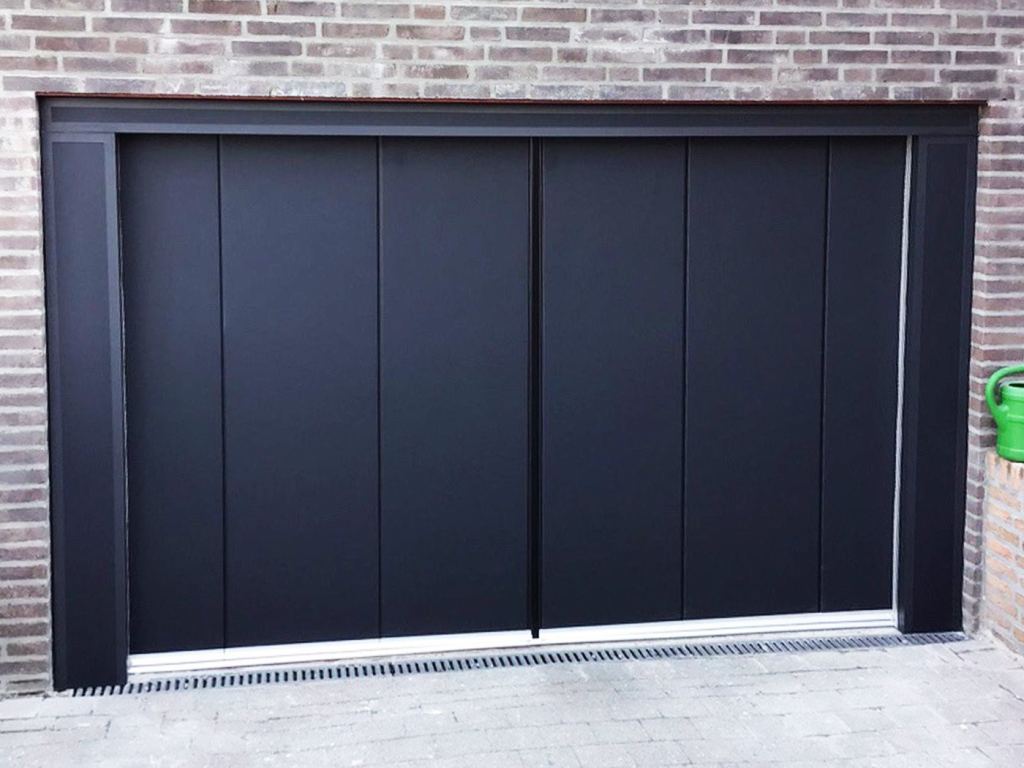 Side-sliding sectional door in a modern black design with a stylish finish.